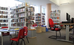 Library showing books, tables and chairs