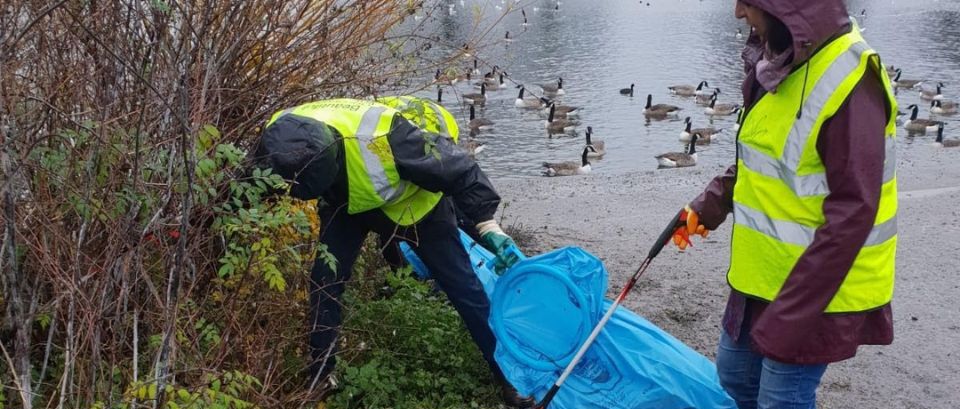 local people litter picking in a Redbridge park