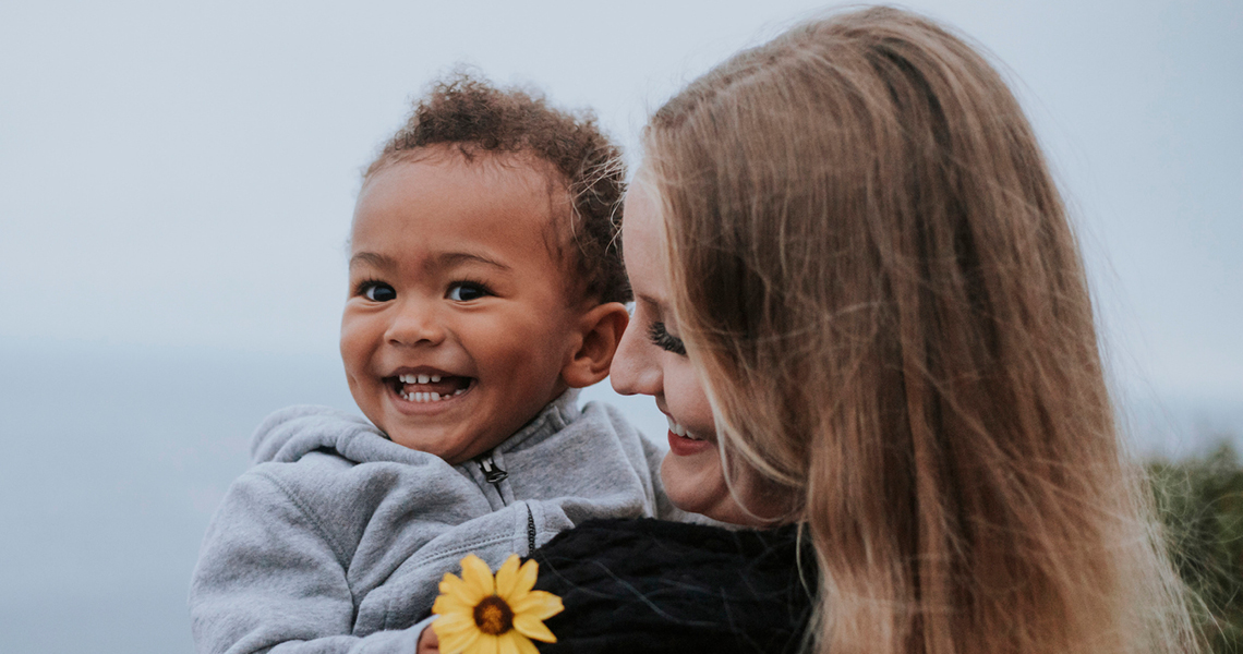 Woman holding a young child