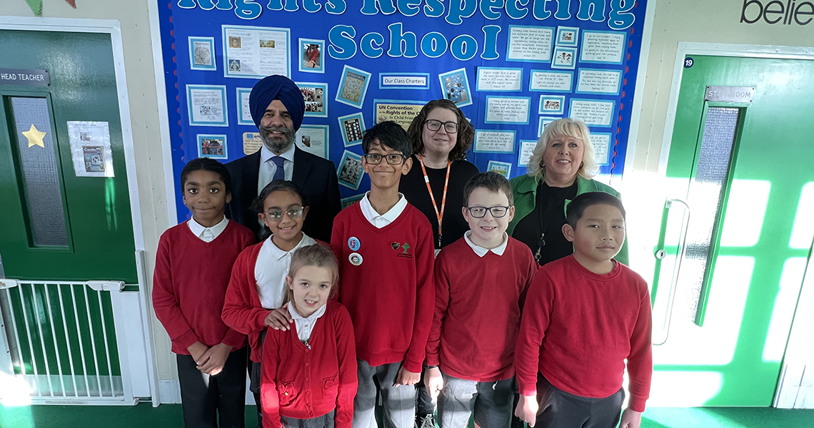 Cllr Jas Athwal with children and teaching staff