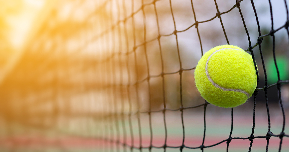 Tennis ball hitting net