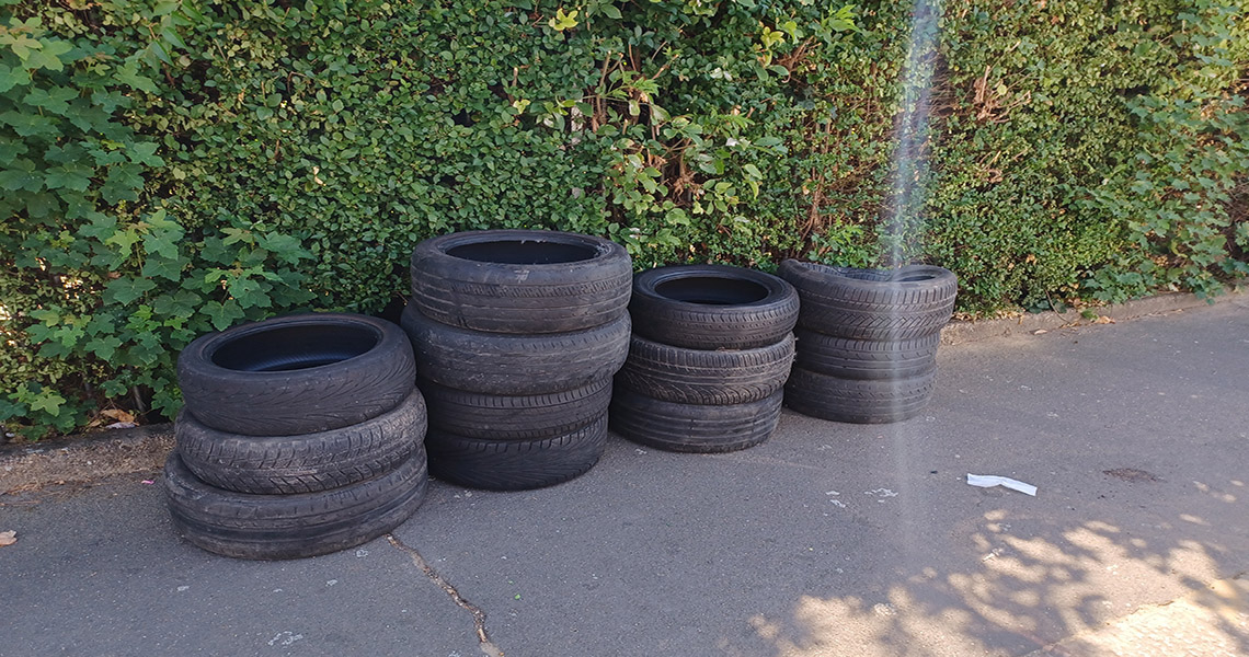 tyres stacked up on pavement