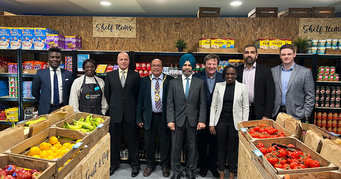 Councillors and grocery staff pictured inside store