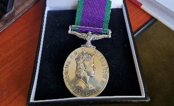 War medal in its box, the lid open