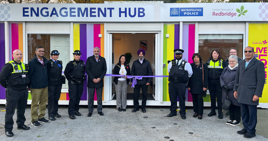 People standing in front of Engagement Hub