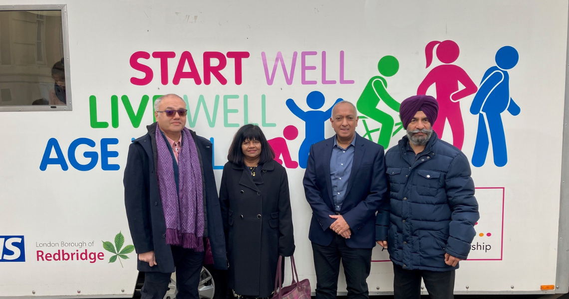 People standing in front of Healthy Redbridge Bus