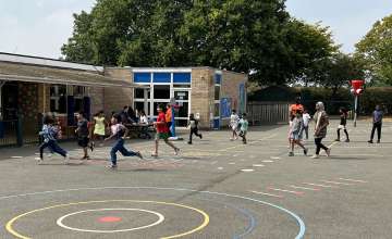 Children running across school playground