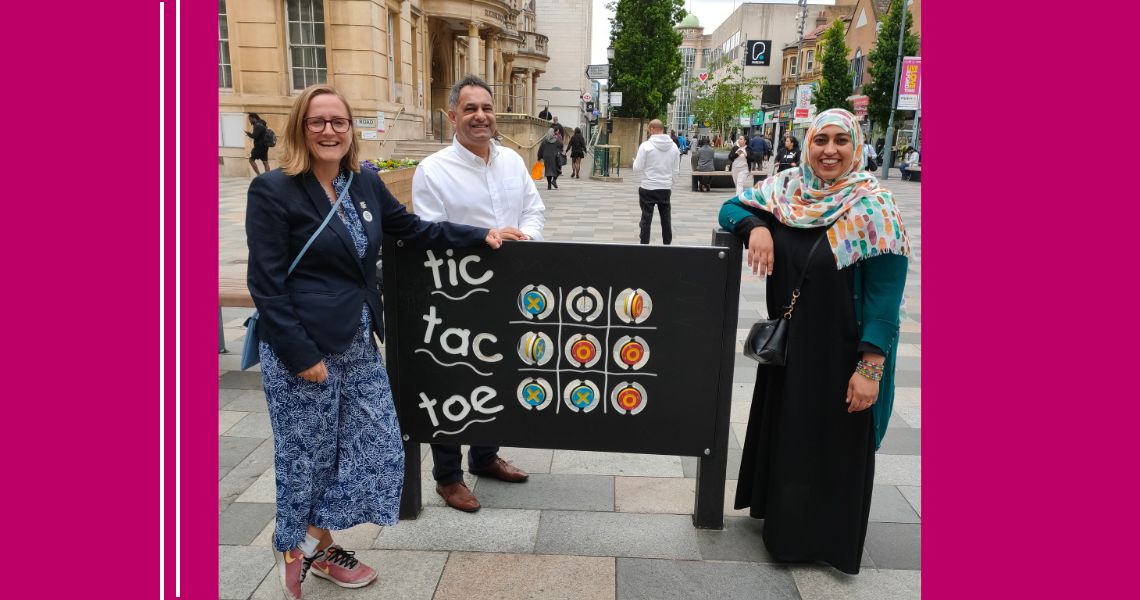 Council staff standing by the play equipment in Ilford High Road