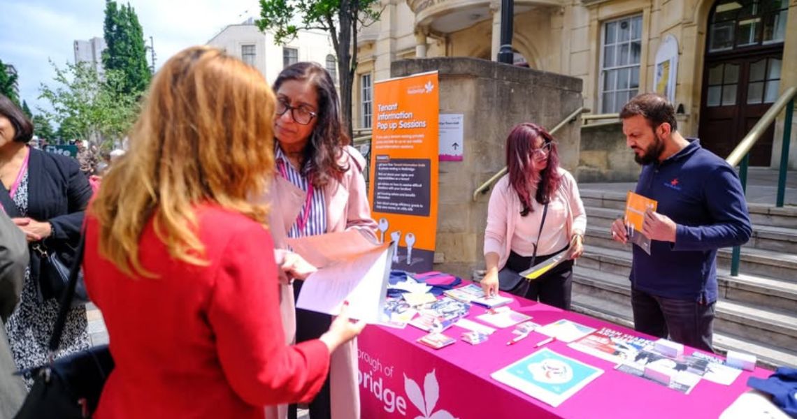 Council officers speaking to members of the public outside the town hall
