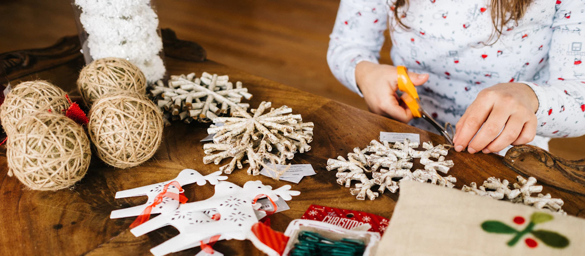 woman making christmas ornaments