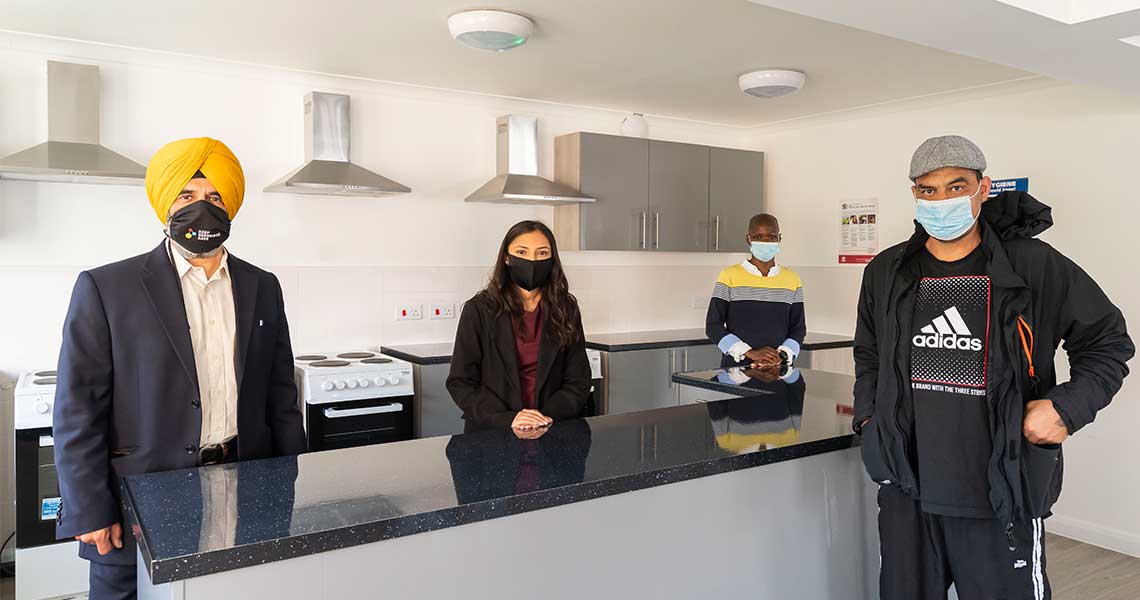 The Leader Councillor Jas Athwal, Councillor Vanisha Solanki, Ryedale Manager and resident in new home