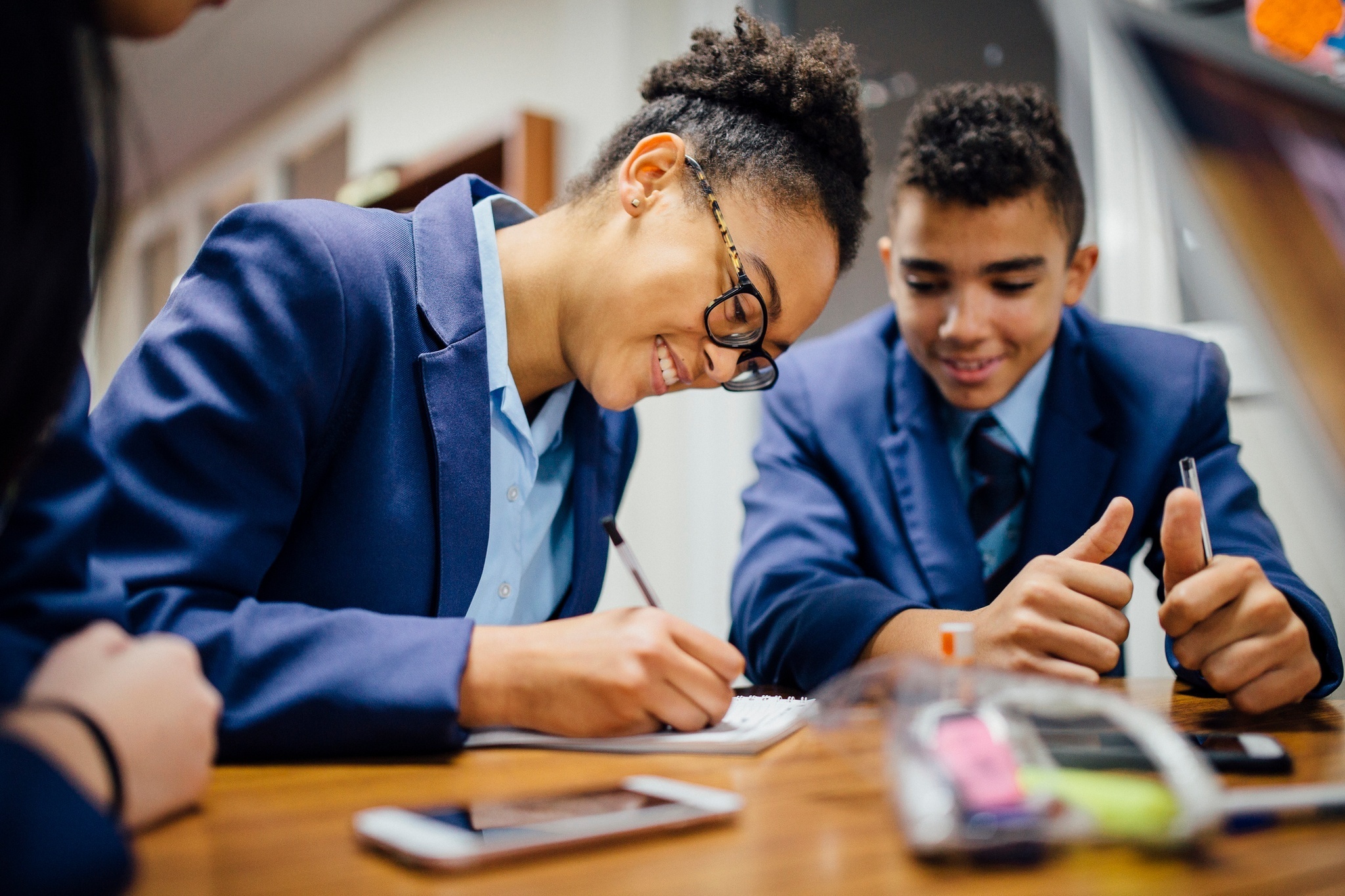 pupils at desk in classroom