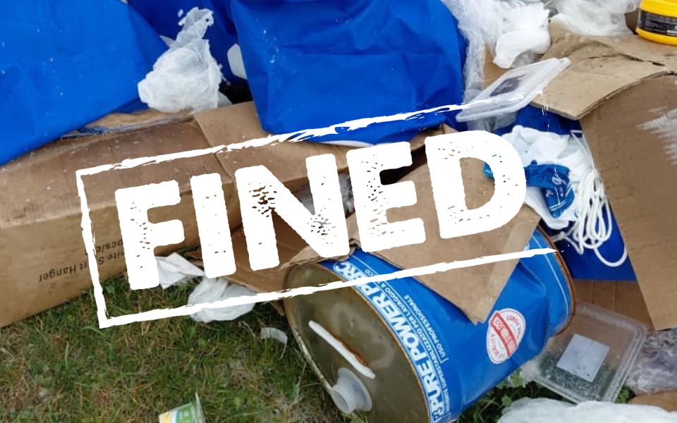 waste with word fined overlayed