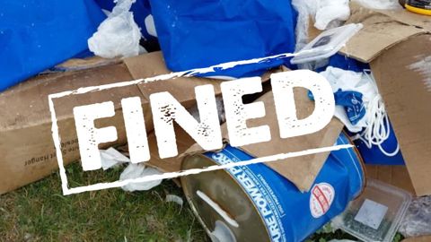 waste with word fined overlayed