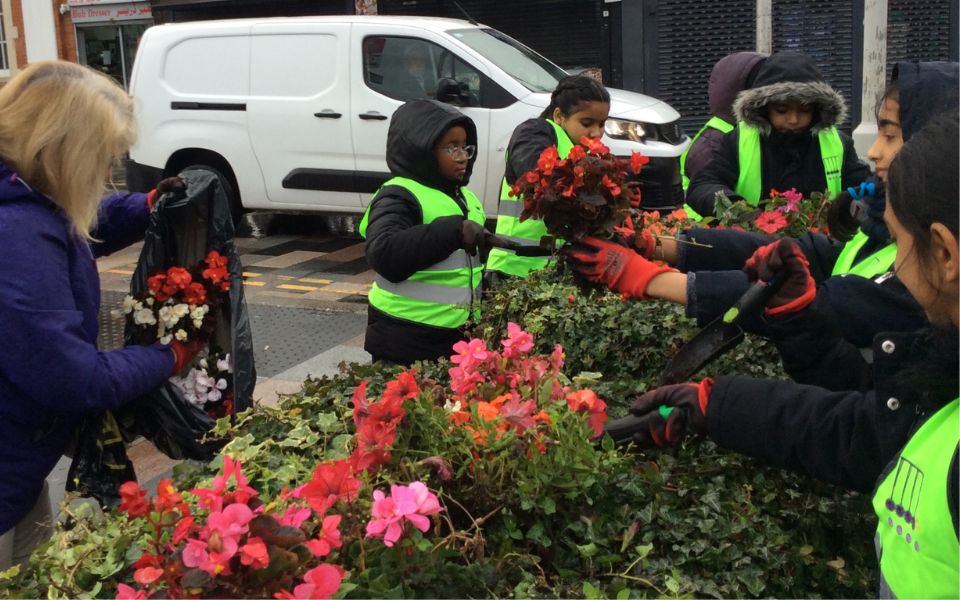 children taking part in community planting day
