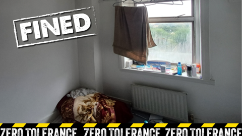 Room with bedding on floor with zero tolerance design and 'Fined' stamp