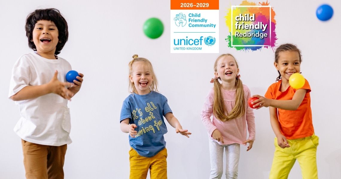 Four young children having fun, throwing coloured balls, with the UNICEF UK and Child Friendly Redbridge logos in the background