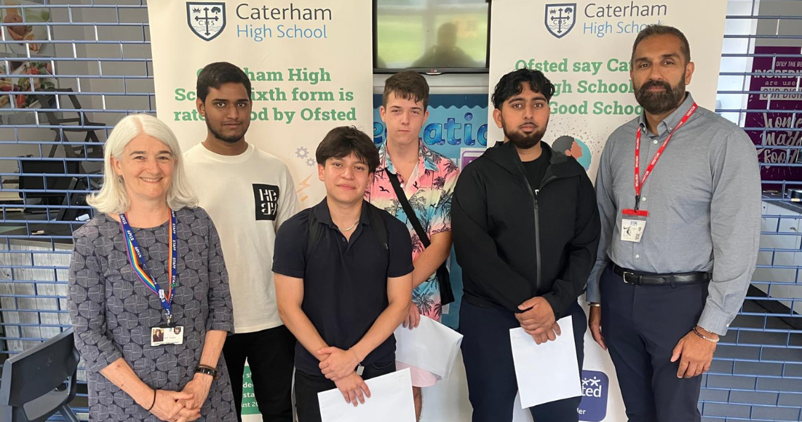 Students from Caterham High School pose with their A level results
