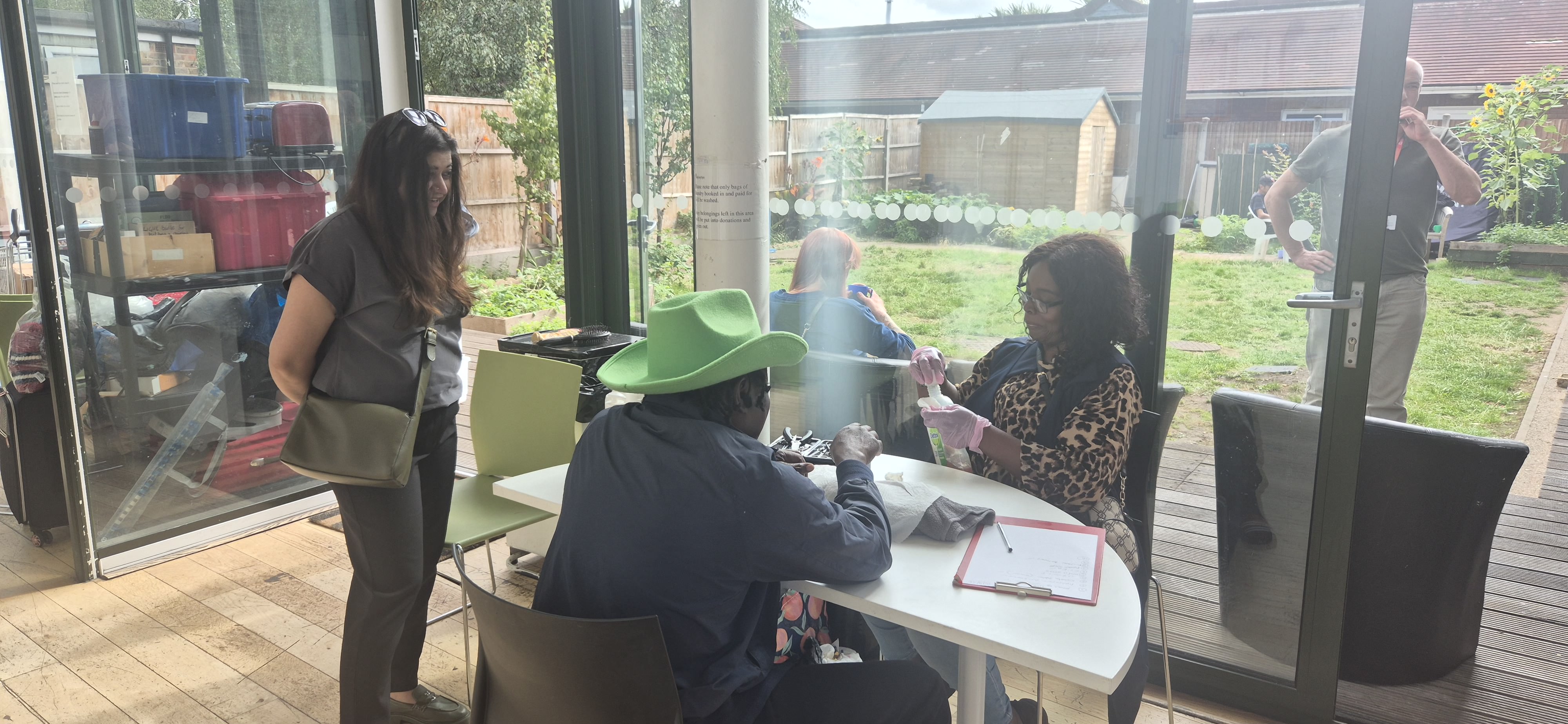 Councillor Saima Ahmed, Cabinet Member for Housing and Homelessness speaks with service users and providers