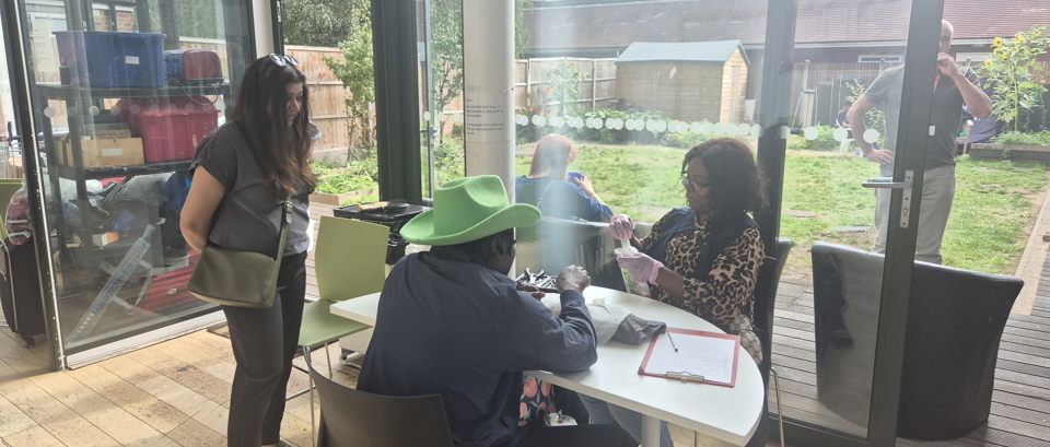 Councillor Saima Ahmed, Cabinet Member for Housing and Homelessness speaks with service users and providers