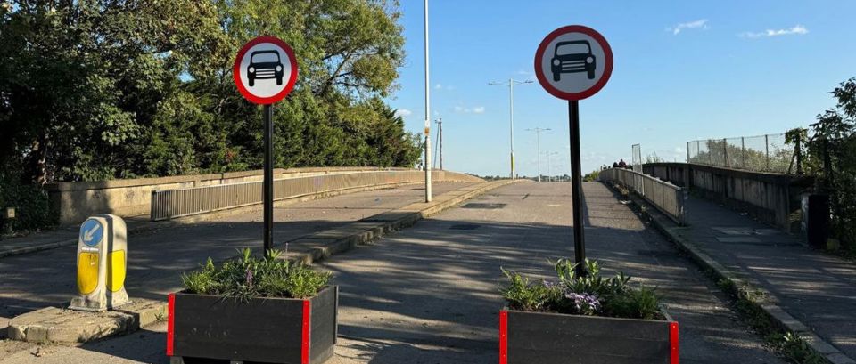 Broadmead Road Bridge with planters and signage