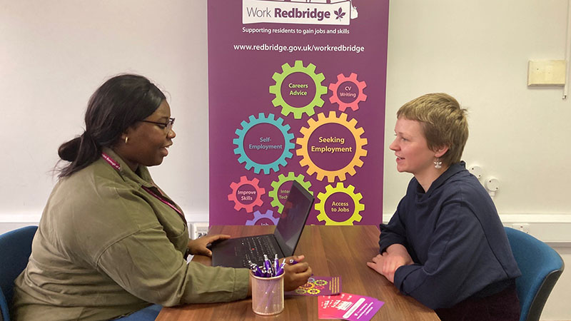 Work Redbridge member of staff speaking to a resident about employability support image